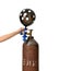 Hands inflate black dotted balloon use Helium Tank with Economy Regulator Fill Valve