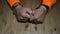 Hands of an inmate with handcuffs on his wrists