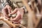 Hands of an instrument maker working on a violin bow