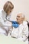 Hands of the internist doctor examine the lungs of a very old woman with a stethoscope.