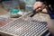 Hands of jeweller at work silver soldering