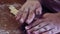 The hands of a Jewish woman forms blanks from dough for baking festive challah