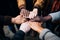 Hands joined in harmony, a close up of a diverse group