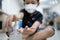 Hands of kid boy with alcohol antiseptic gel,wash hands with hand sanitizer to avoid contamination with Coronavirus,asian child