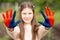 Hands of kid girl painted in Mongolia flag color. Focus on hands. July 10 National Flag Day. Independence Day of