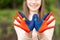 Hands of kid girl painted in Mongolia flag color. Focus on hands. July 10 National Flag Day. Independence Day of