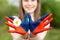 Hands of kid girl painted in Mongolia flag color. Focus on hands. July 10 National Flag Day. Independence Day of