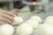 Hands kneading bread dough