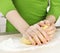 Hands kneading dough