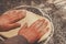 Hands kneading dough for pizza making