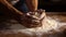 Hands Kneading dough on wooden bench