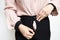 Hands of lady girl trying to zipping up her pants,try to close her tight pants with difficult from fat,weight gain,overweight or