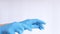 Hands in latex medical gloves. The doctor puts rubber blue gloves on the hands