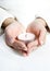 Hands with lighted candle