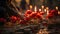 Hands lighting candles between flowers on graves