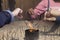 Hands lighting incense sticks at the temple of Todai-ji in nara in japan