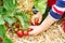 Hands of little child picking strawberries