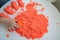 Hands little girl playing with kinetic sand. development of fine motor skills