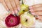 Hands with long artificial french manicured nails decorated with glitter