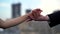 Hands of loving people, married man and woman are stroking arms, closeup