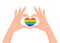 Hands make heart signwith LGBT rainbow color. Love is love. Pride concept