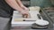 Hands make long sushi roll. Sushi chef demonstrating skill. Famous japanese dish. top view