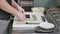 Hands make long sushi roll. Sushi chef demonstrating skill. Famous japanese dish. top view