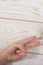 Hands making rock, paper, scissors gesture on wooden background