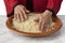 Hands making traditional Moroccan couscous