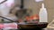 Hands of male chef cook frying meat in kitchen