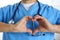 Hands of male medicine therapeutist doctor wearing blue