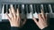 Hands of male musician playing at synthesizer. Mens arms plays solo of music or new melody. Close up fingers of pianist