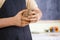 Hands of Male Potter Professional Making a Clay Lump on Workbench