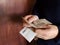 hands of a man counting uruguayan banknotes