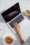 Hands man on laptop keyboard and coffee with donut. Easy work life style at home in the morning