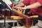 Hands of man playing a zither