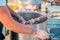 The hands of a man skewering meat on a skewer