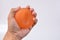 Hands of a man squeezing a stress ball