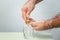 Hands of a man taking alcohol hand sanitizer gel to clean his hands.