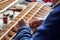 Hands of a man who makes the wing of a radio-controlled aircraft, the construction of the airplane