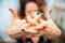 Hands mantra close up and copy space. Girl practicing yoga on the veranda. Woman in yoga asanas in a greenhouse with flowers