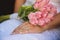 The hands of married couples and the wedding bouquet