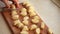 hands of the master cut the dough into pieces close-up. Baking from wheat flour. Cooking food at home