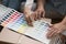 Hands of mature couple choosing wall decoration colors