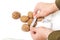 Hands measuring large nuts tailor measuring tape