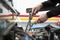 Hands of a mechanic repairing a car. Unrecognizable person working in a workshop