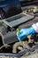 Hands of a mechanic who is preparing to change oil and fill the engine oil of a diesel engine