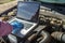 Hands of a mechanic who is preparing to change oil and fill the engine oil of a diesel engine