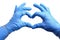 Hands in medical gloves depict a heart on a white background, isolated. Patient care