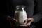 Hands with milk jar closeup photo. Generate ai